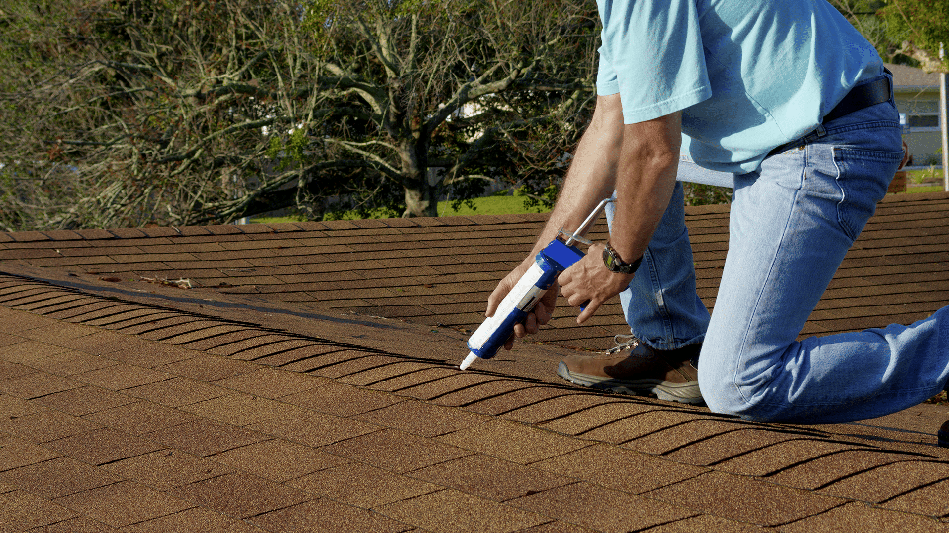 DIY roof patching: An example of proactive material maintenance.