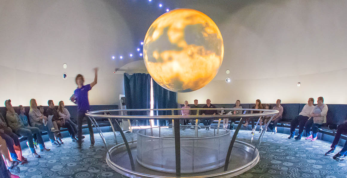 Experience the wonders of Science on a Sphere, a captivating interactive exhibit at Science City.
