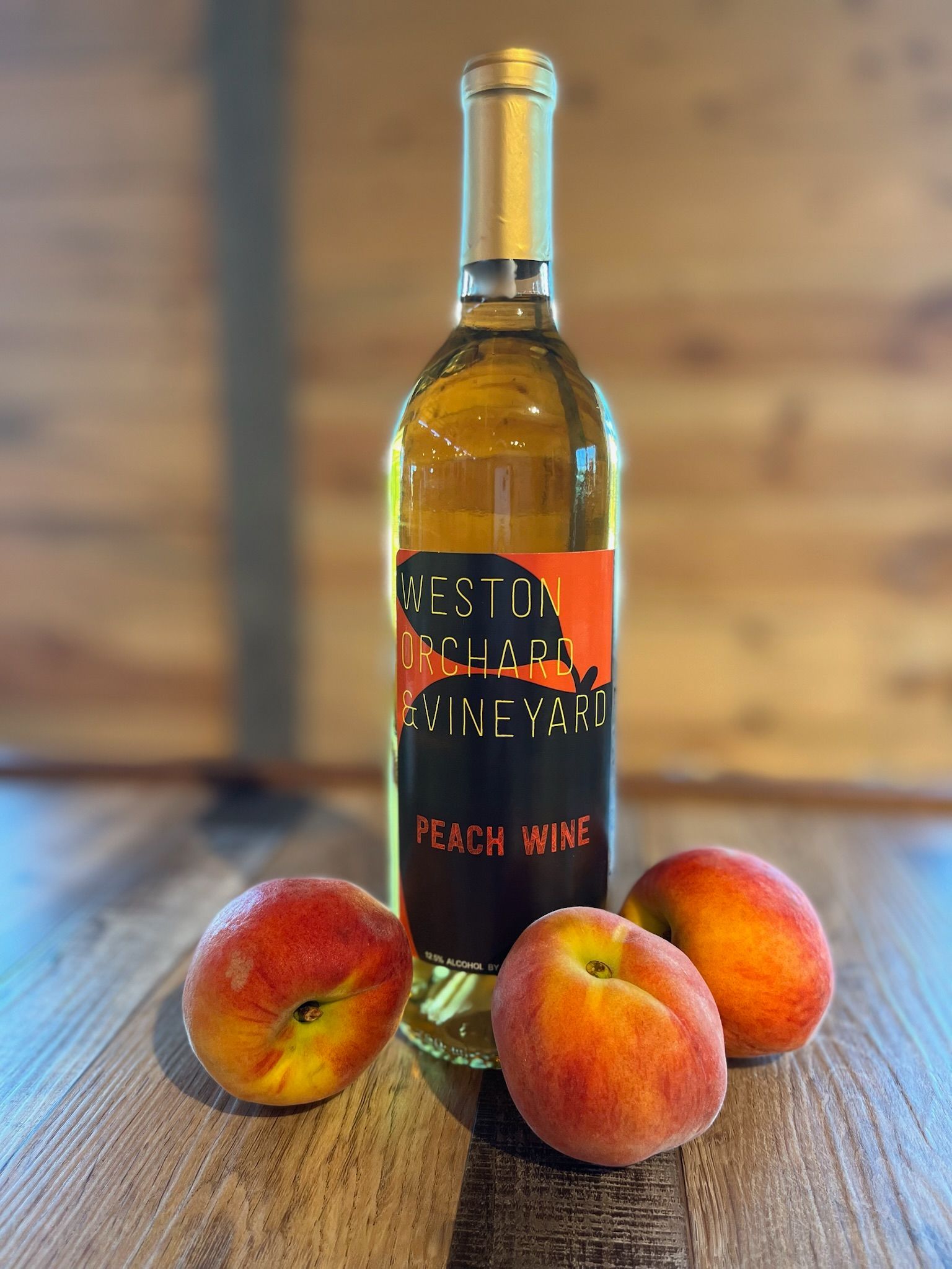 Estate-made peach wine paired with fresh peaches from the orchard.