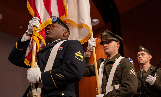 Color guard marching during a Veterans Day ceremony in Kansas City — a symbol of honor and remembrance.