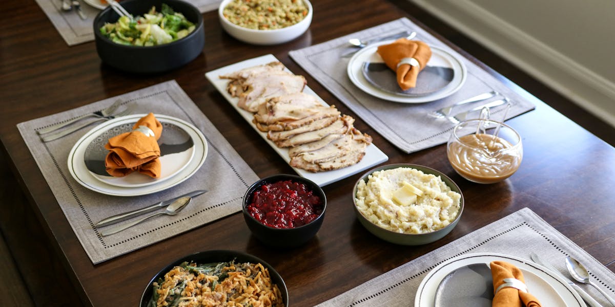 Pre-ordered Thanksgiving meal boxes available for pickup across Kansas City neighborhoods.